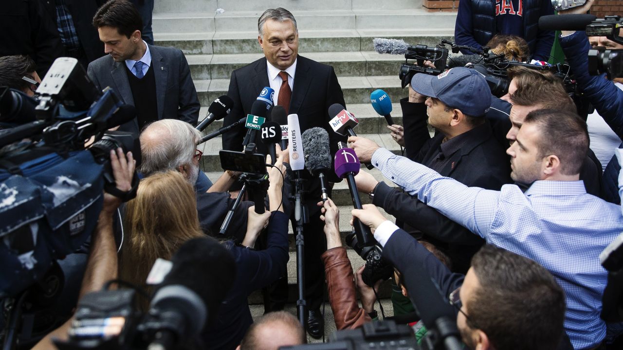Hungarian Prime Minister Viktor Orban speaks to media after casting his vote.