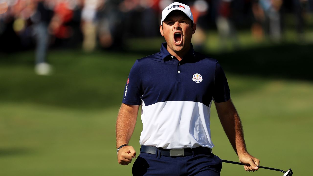 Patrick Reed of the United States reacts to making a putt on the first green. His victory over Rory McIlroy in the top match proved crucial.