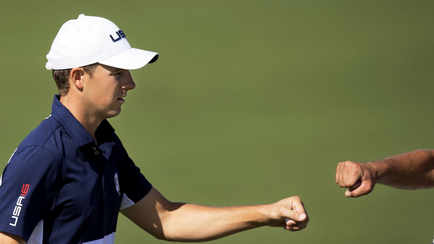 Team USA's Jordan Spieth fist bumps his caddy Michael Greller during the singles matches. He eventually lost to Henrik Stenson in a rare last day win for Europe.