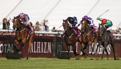 Ryan Moore, riding Found, charged clear to win The Qatar Prix de l'Arc de Triomphe at Chantilly racecourse in Paris.