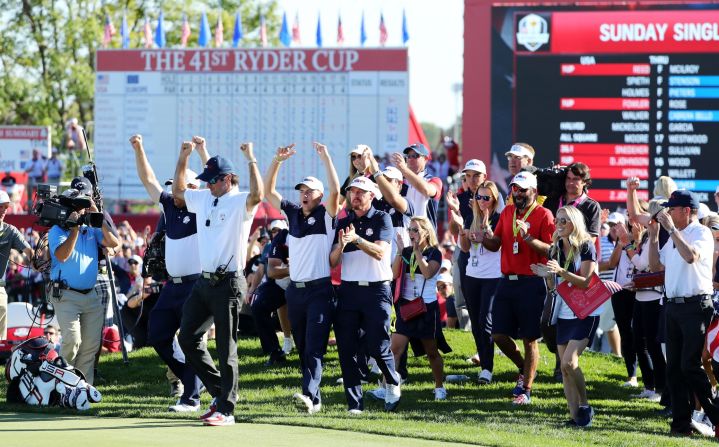 US players celebrate on the 18th green as their team closed out victory over Europe.