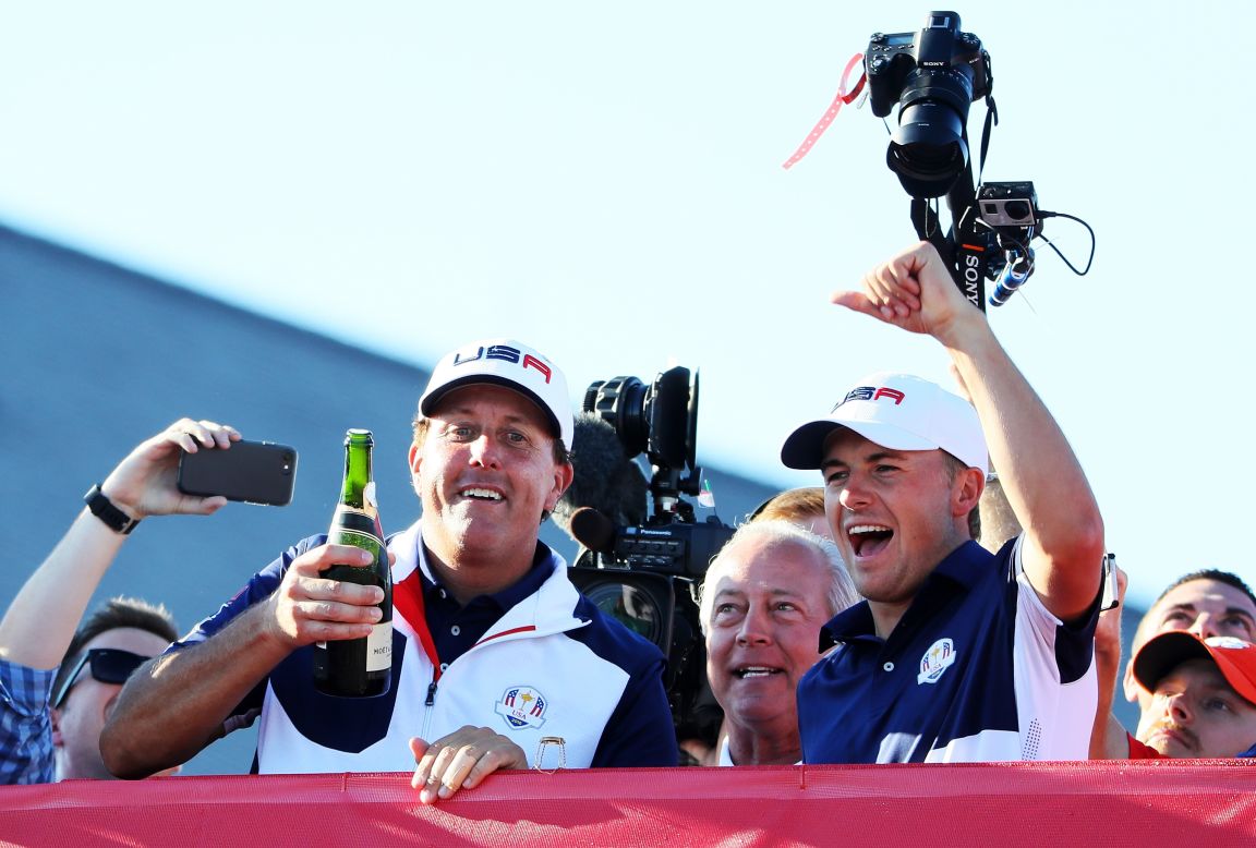 Phil Mickelson and Jordan Spieth of the United States celebrate with champagne after winning the Ryder Cup for their team.  
