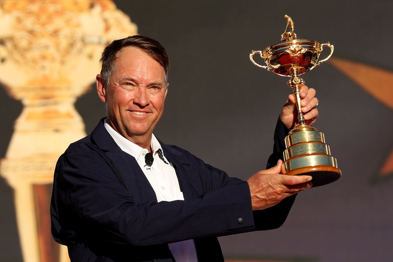 US captain Davis Love III holds the Ryder Cup aloft after his team beat Europe in the 2016 edition.