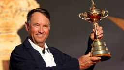 US captain Davis Love III holds the Ryder Cup aloft after his team beat Europe in the 2016 edition.