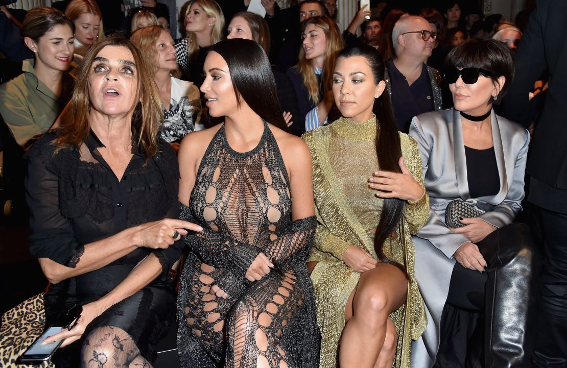 Kardashian West attends Paris Fashion Week with her sister and mother.