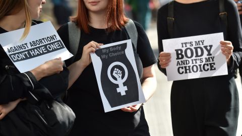 Women protest on Monday in Warsaw. Many were dressed in black. 