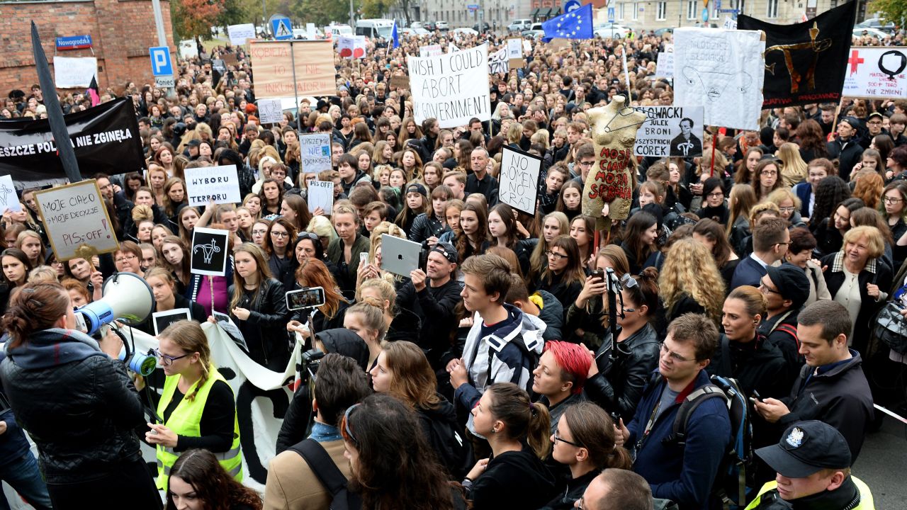 People take part in a nationwide strike and demonstration to protest a legislative proposal for a ban of abortion on Monday, October 3, in Warsaw, Poland.