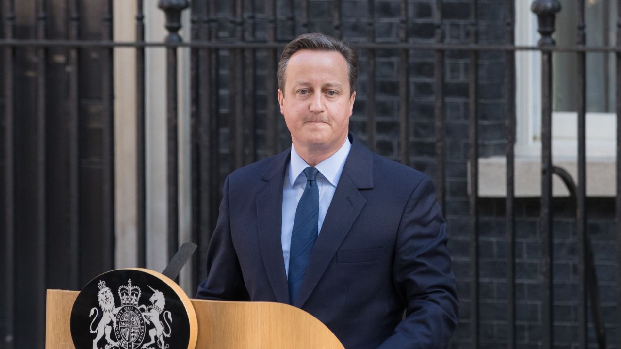 British Prime Minister David Cameron resigns on the steps of 10 Downing Street.