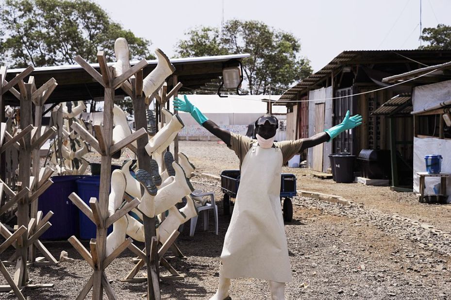 There were celebrations when the West African Ebola epidemic was declared "no longer an emergency" in March 2016. But while the outbreak is over, Ebola is is still out there. Pictured, a Liberian worker dismantling shelters in a treatment center in March 2015.
