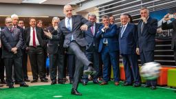 TOPSHOT - FIFA's President Gianni Infantino kicks a football during an event at the Sergio Arboleda University in Bogota, on October 3, 2016.
Infantino arrived in Colombia to attend the final of the final of the Colombia 2016 FIFA Futsal World Cup on October 1.   / AFP / Jose Miguel GOMEZ        (Photo credit should read JOSE MIGUEL GOMEZ/AFP/Getty Images)
