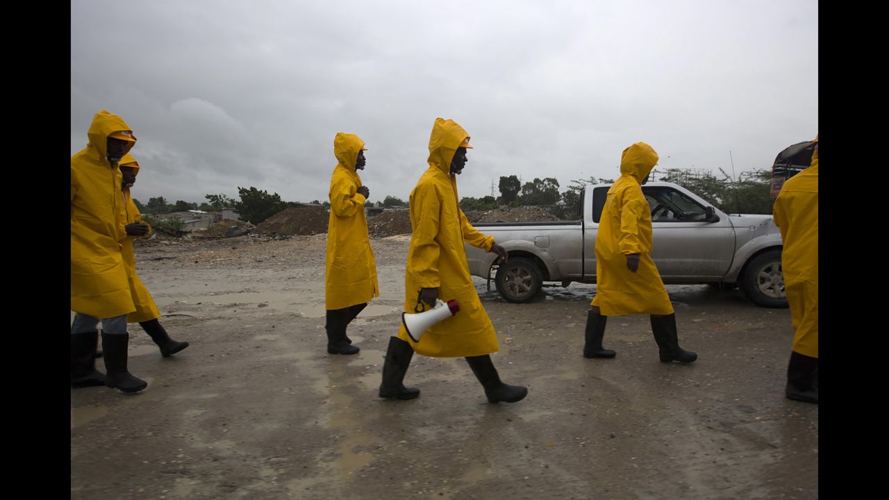 Haitian civil protection workers arrive to evacuate the Tabarre region of Haiti on October 3.