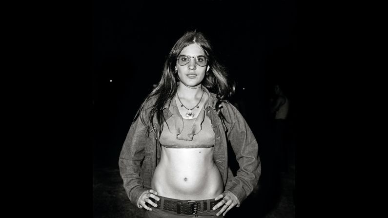 Yates shot all his pictures with a medium format, twin-lens camera. Because he worked at night and the rink was so dimly lit, he used flash for all of them. It made his subjects appear a little like performers on a stage.