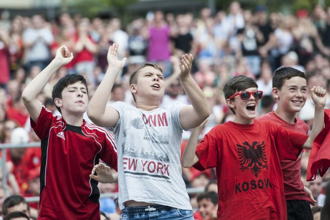 Albania's qualification for Euro 2016 was popular with fans in Kosovo. Here young boys watch the match against Switzerland on a big screen in the capital Pristina.
