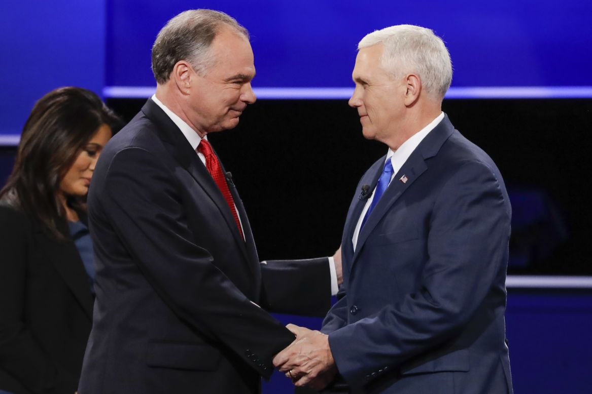 The two vice presidential candidates shake hands before the start of the debate.