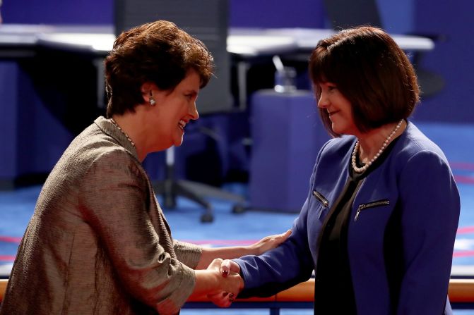 Kaine's wife, Anne Holton, greets Karen Pence, right, before the debate.