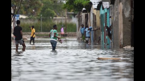 People wade through the flooded streets of Cite Soleil in the Haitian capital of Port-au-Prince on October 4. Hurricane Matthew is the strongest storm to hit Haiti since 1964 and the first hurricane to make landfall in the country since the devastating earthquake in 2010.