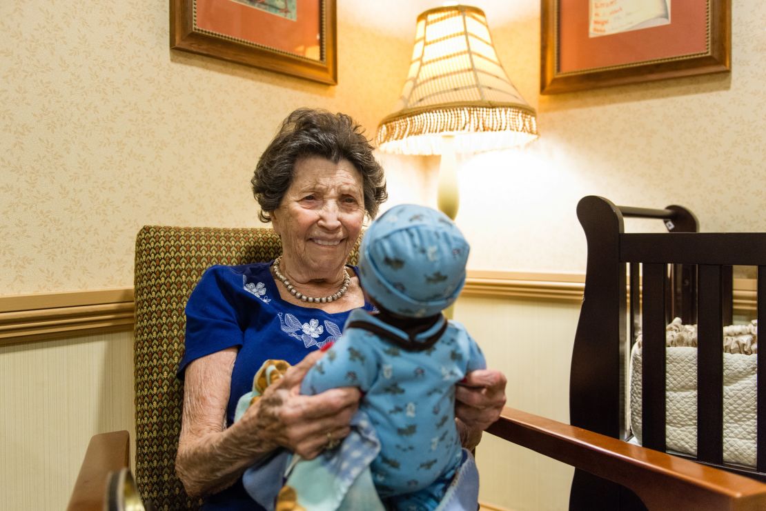 Vivian Guzofsky, 88, holds a baby at Sunrise Senior Living in Beverly Hills, California.