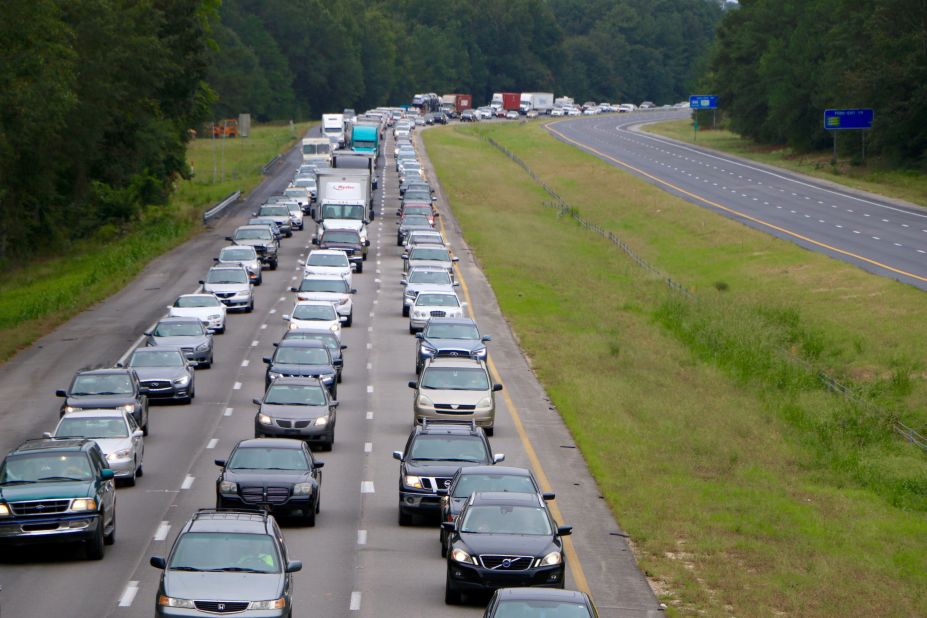 Bumper-to-bumper traffic lines Interstate 26 in Columbia, South Carolina, as people drive west on October 5.