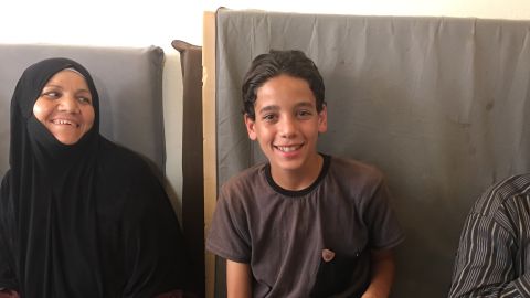 Amjad, the Darayya librarian, taught his mother (left) to read