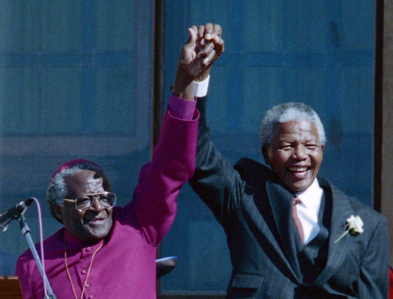 Tutu stands with Mandela after Mandela was elected president in 1994.