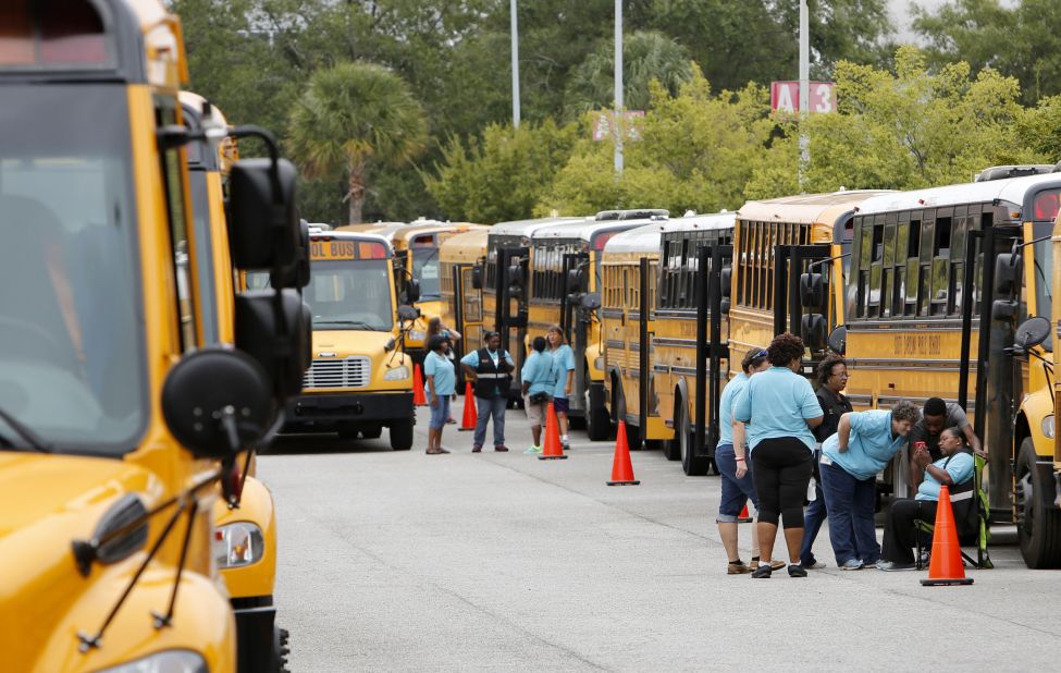 Bus drivers in North Charleston, South Carolina, wait for word to start evacuations.