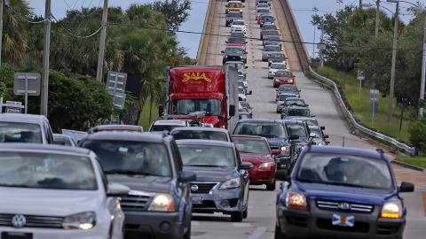 Cars crammed roads as people fled evacuation zones in Florida as Hurricane Matthew approached.