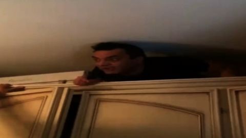Italian mafia boss Antonio Pelle emerges from his cupboard hideout.
