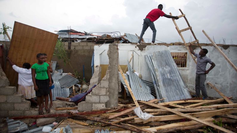 Residents repair their homes in Les Cayes, Haiti, on October 6. <a href="index.php?page=&url=http%3A%2F%2Fwww.cnn.com%2F2016%2F10%2F04%2Famericas%2Fhurricane-matthew%2Findex.html" target="_blank">The damage from Hurricane Matthew</a> was especially brutal in southern Haiti, where sustained winds of 130 mph punished the country.