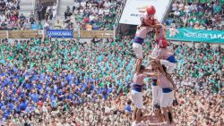 TARRAGONA, SPAIN - OCTOBER 02: Members of Tarragona's team make the tower during the Spain's traditional human towers competition "Concurs de Castells" at Tarraco Arena in Tarragona, Spain on October 02, 2016.  (Photo by Albert Llop/Anadolu Agency/Getty Images)
