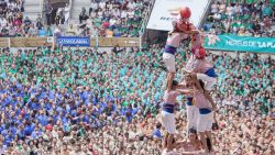 TARRAGONA, SPAIN - OCTOBER 02: Members of Tarragona's team make the tower during the Spain's traditional human towers competition "Concurs de Castells" at Tarraco Arena in Tarragona, Spain on October 02, 2016. (Photo by Albert Llop/Anadolu Agency/Getty Images)