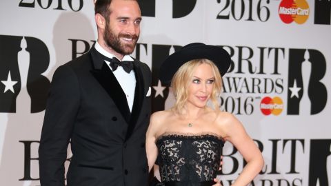 Singer Kylie Minogue, right, and Joshua Sasse pose for photographers upon arrival for the Brit Awards 2016 at the 02 Arena in London, Wednesday, Feb. 24, 2016. (Photo by Joel Ryan/Invision/AP)