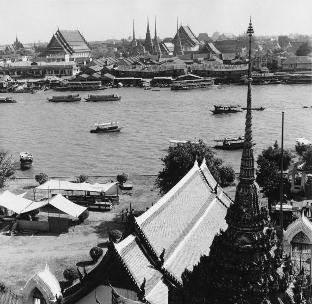 A view across the Chao Phraya River in Bangkok, with the Royal Palace in the background. 