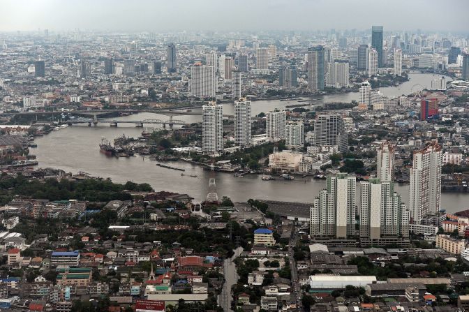 This aerial picture taken on April 5, 2014 shows a general view of the skyline and the Chao Phraya river passing through Bangkok. Although beset by regular political and economic troubles, the Thai capital has expanded rapidly, reflecting the nation's recent strong economic growth.