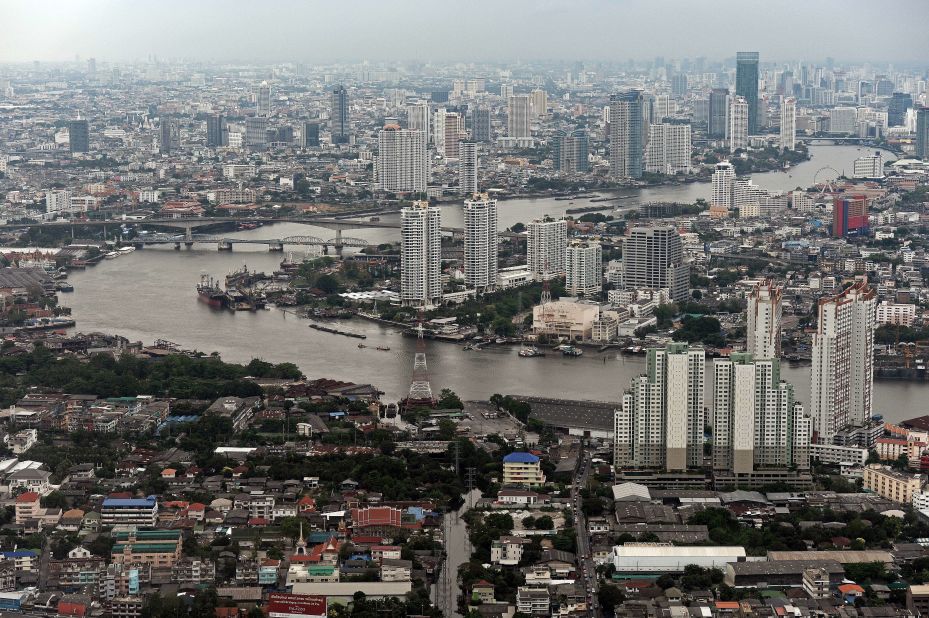 This aerial picture taken on April 5, 2014 shows a general view of the skyline and the Chao Phraya river passing through Bangkok. Although beset by regular political and economic troubles, the Thai capital has expanded rapidly, reflecting the nation's recent strong economic growth.
