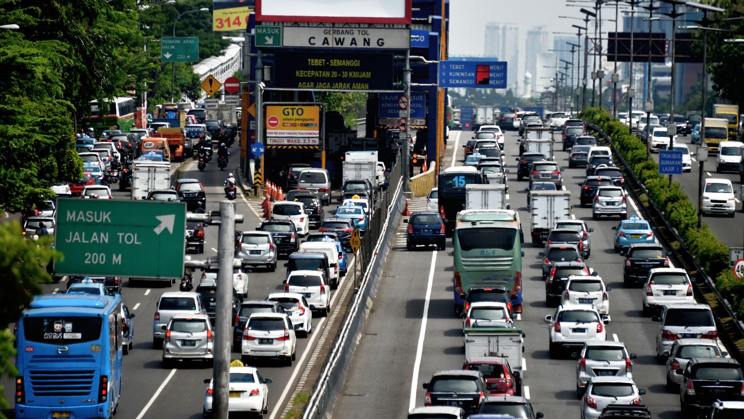 A general view shows traffic commuting on a congested road in Jakarta on June 2, 2016.
 