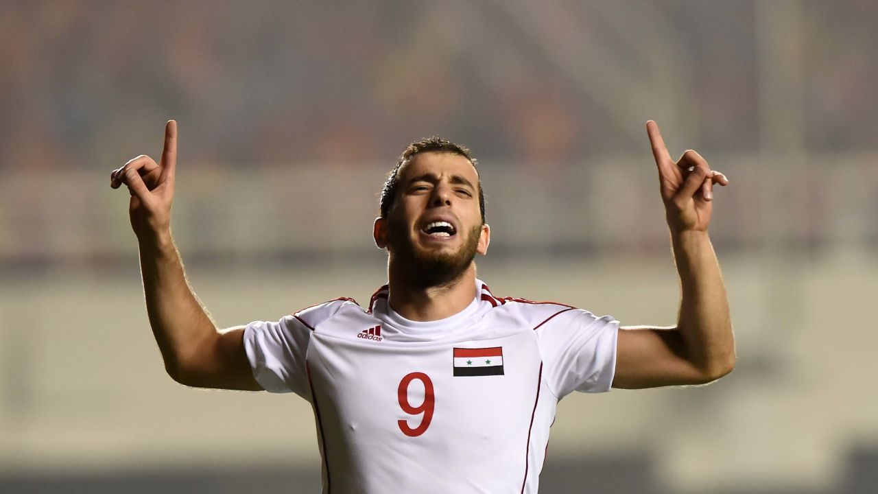 Mahmoud Al-Mawas celebrates his winning goal against China in World Cup qualifying.