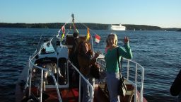 Anna Politkovskaya, right, and Tanya Lokshina on a boat headed from Stockholm in September 2006.