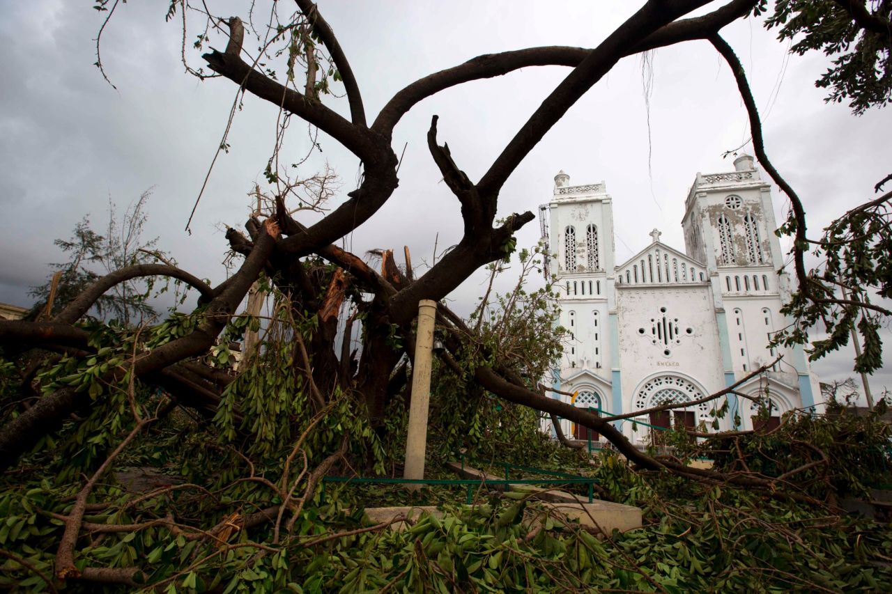 Fallen trees litter the ground outside a damaged church in Les Cayes on October 6. Hundreds of people have been killed in Haiti, the Dominican Republic and St. Vincent and the Grenadines, officials said, with the death toll expected to rise. 