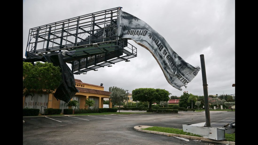 A billboard canvas flaps in the wind after Hurricane Matthew passed North Palm Beach, Florida, on October 7.