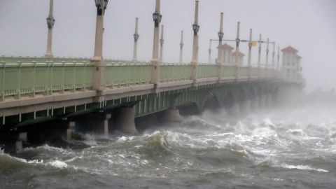 Waves crash against a bridge in St. Augustine, Florida.