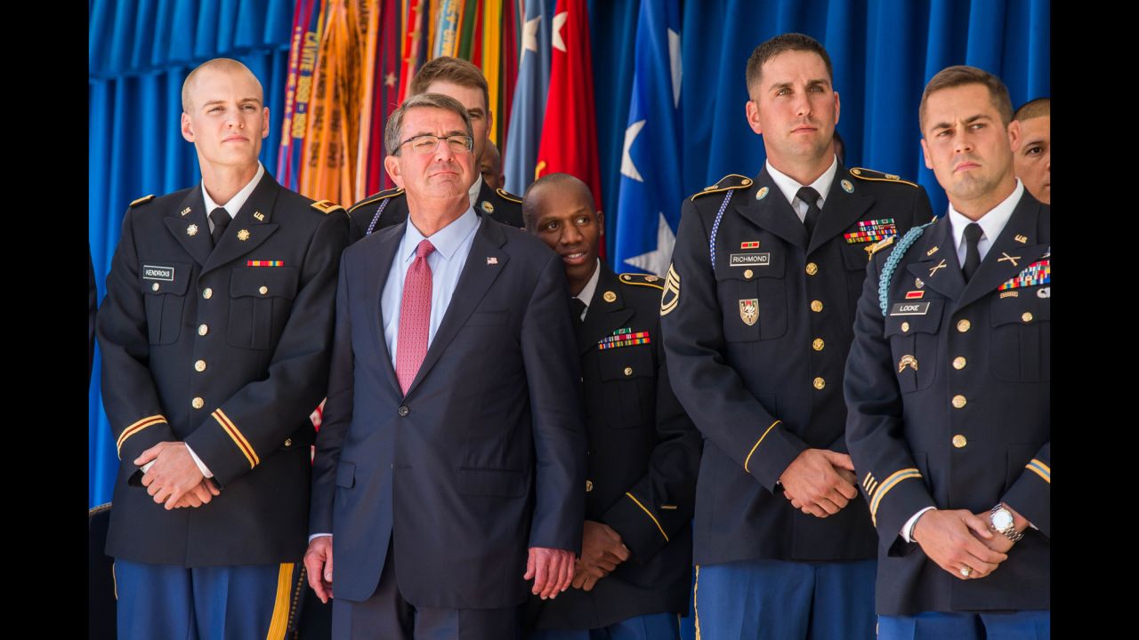 During a ceremony at the Pentagon on Monday, October 3, US Defense Secretary Ash Carter stands with members of the military who competed at the 2016 Olympics in Rio de Janeiro. 