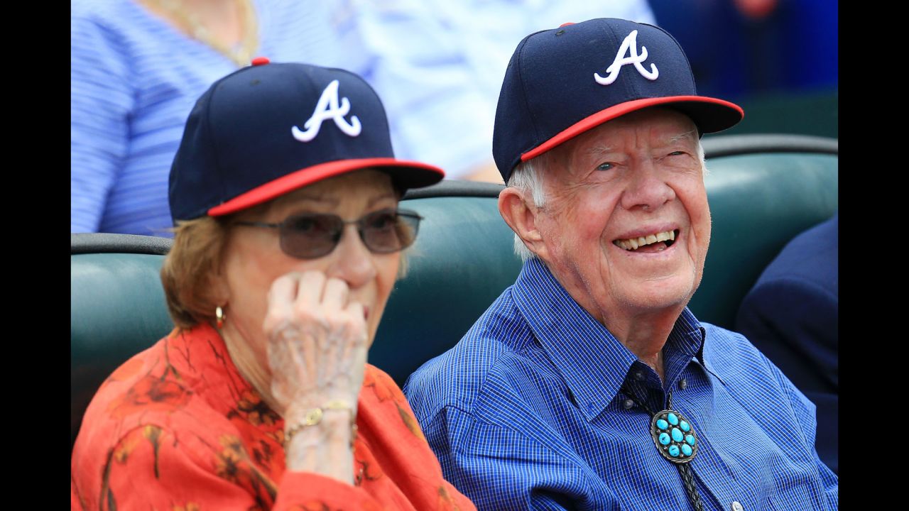 Former US President Jimmy Carter sits in the stands for an Atlanta Braves baseball game on Sunday, October 2.