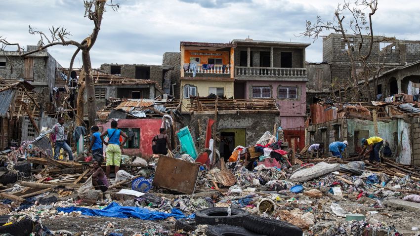 People stand in their destroyed town of Jeremie, Haiti on Thursday October 6.
