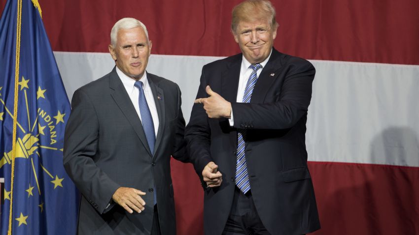Presumptive US Republican presidential candidate Donald Trump (R) and Indiana Governor Mike Pence (L) take the stage during a campaign rally at Grant Park Event Center in Westfield, Indiana, on July 12, 2016.  / AFP / Tasos KATOPODIS        (Photo credit should read TASOS KATOPODIS/AFP/Getty Images)