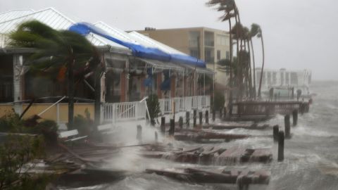 Heavy waves pound boat docks at the Sunset Bar and Grill.