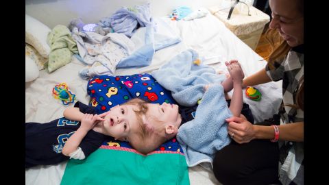 Nicole plays with Jadon, the one she describes as the troublemaker but still "sweet and cuddly and he likes to be snuggled." She longs to hold each child individually.