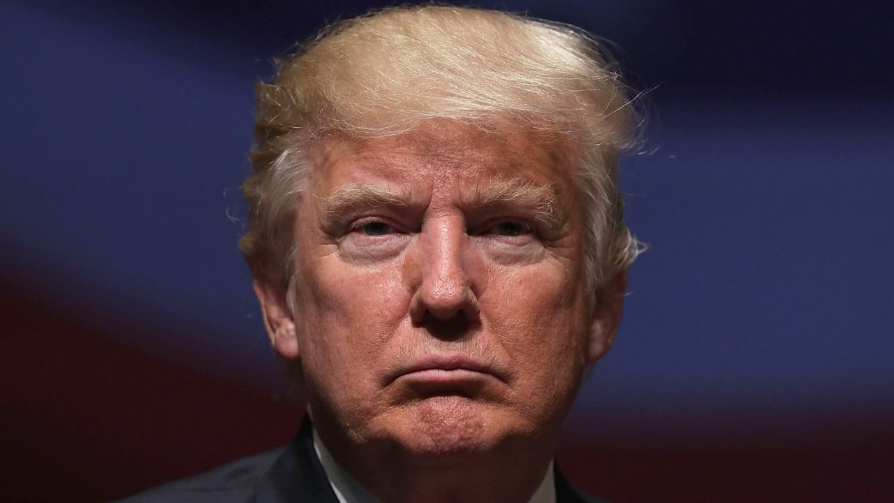 Republican presidential nominee Donald Trump pauses during a campaign event September 6, 2016 in Virginia Beach, Virginia. Trump participated in a discussion with retired Army Lieutenant General Michael Flynn.