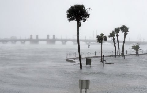 Water flows over a seawall and fills the streets of St. Augustine, Florida, on October 7.