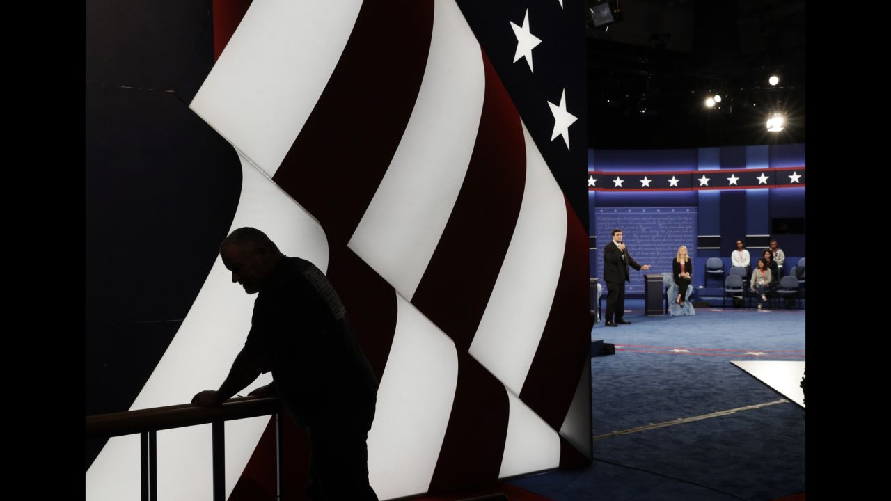 Students stand in on the stage as preparations are made for the second presidential debate between Republican presidential nominee Donald Trump and Democratic presidential nominee Hillary Clinton at Washington University in St. Louis on Saturday, October 8. The debate is set to air Sunday, October 9.