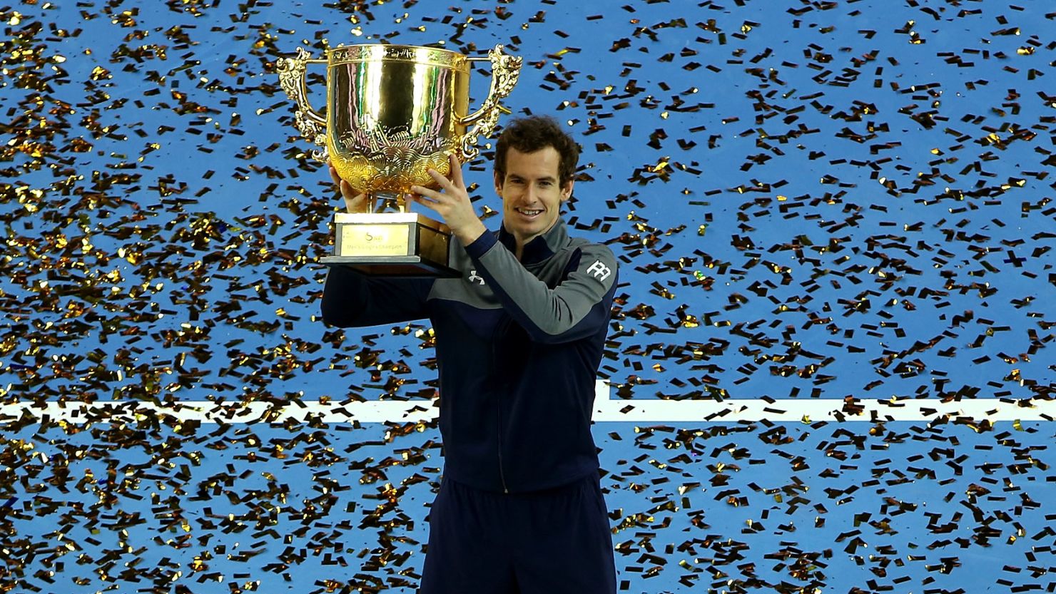 Andy Murray of Great Britain poses with his trophy after winning the China Open for the first time.